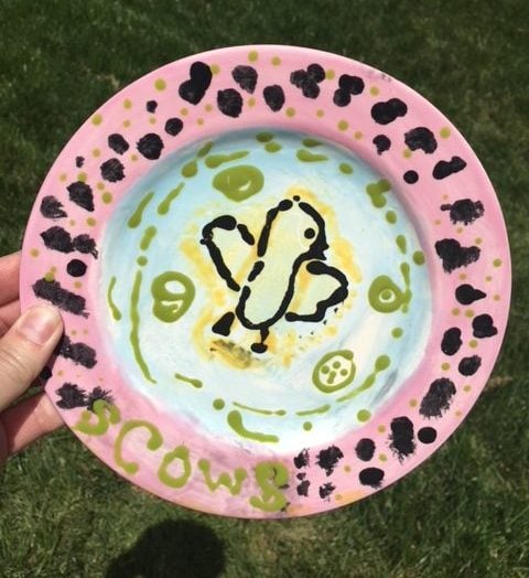 Ceramic plate of a chick hand-painted by a child